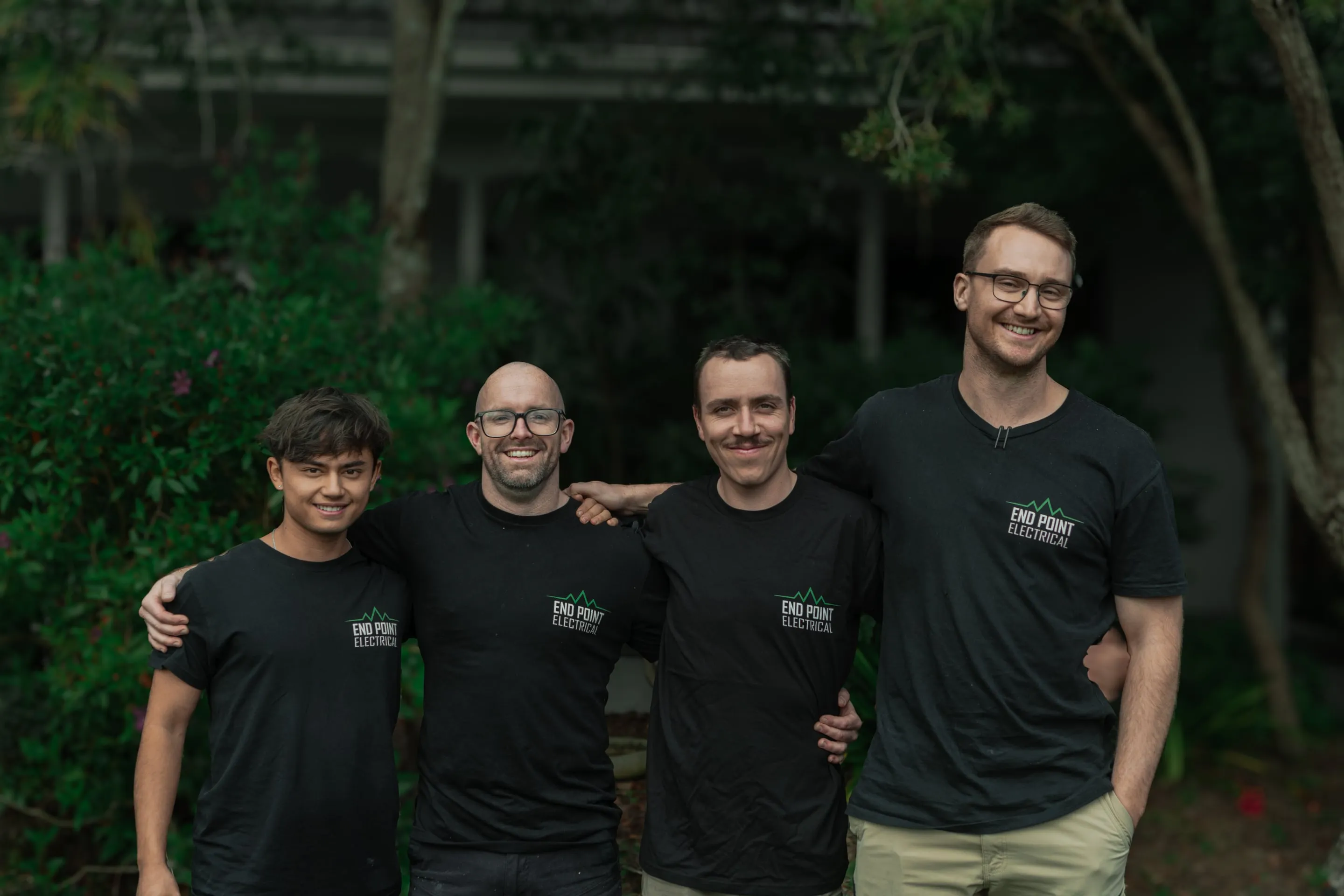 The End Point Electrical team standing together outdoors